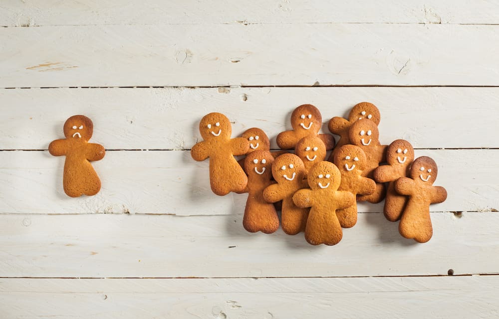 Gingerbread people; one is sad