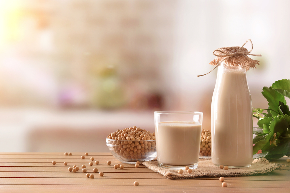 Soy milk in jar and glass